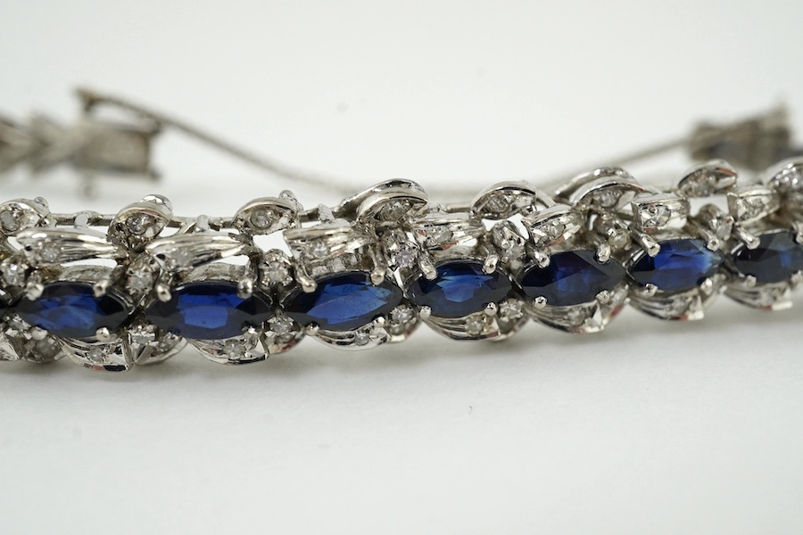 A modern white metal, synthetic? sapphire and diamond chip set bracelet, approx. 17cm. Condition - fair to good